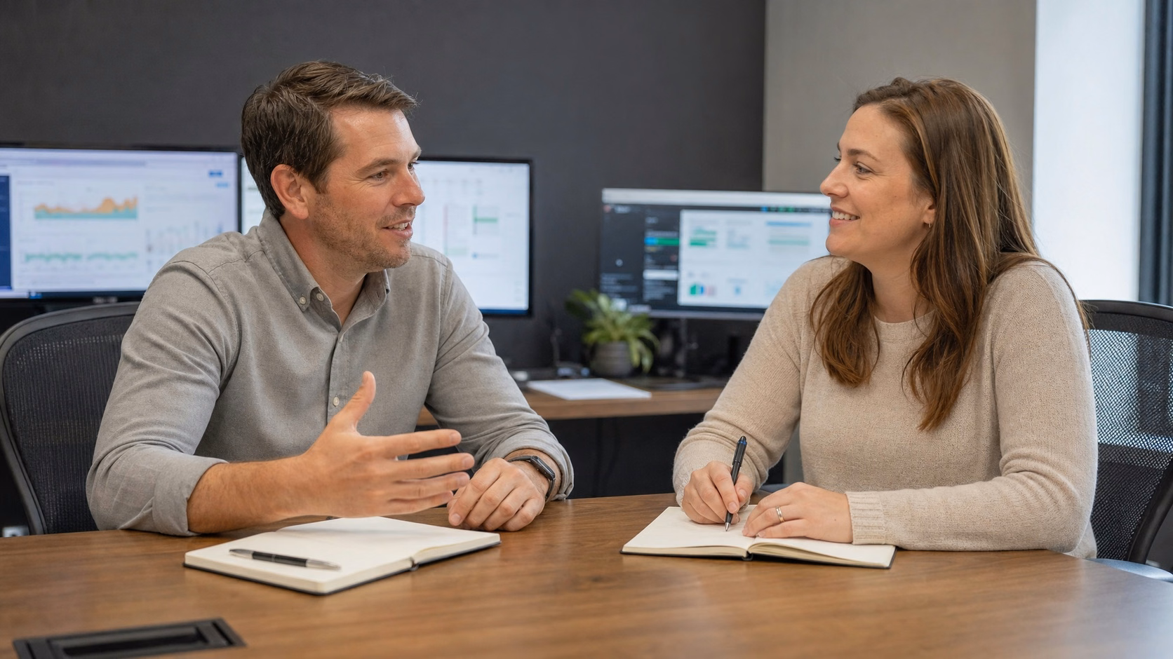 Business meeting, coworkers discuss strategy at table 58