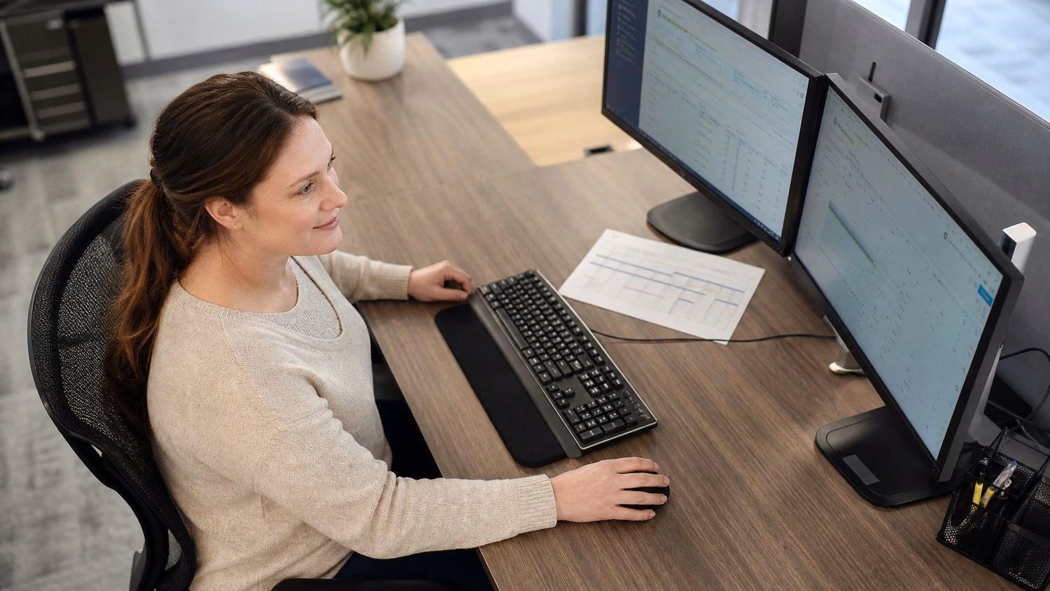 Woman navigates release deployment plan on computer screen