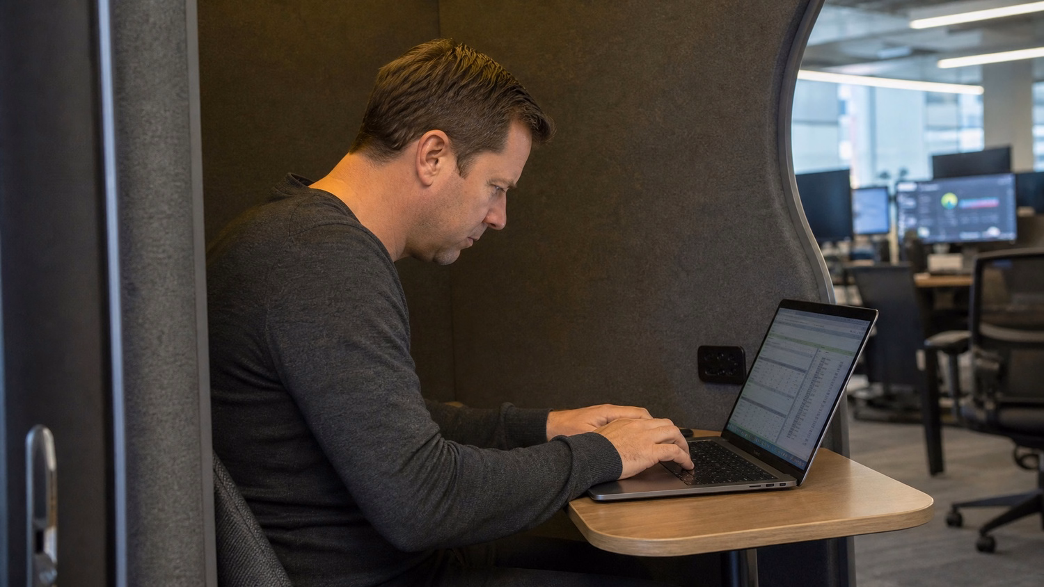 Two IT professionals reviewing tablet screen together