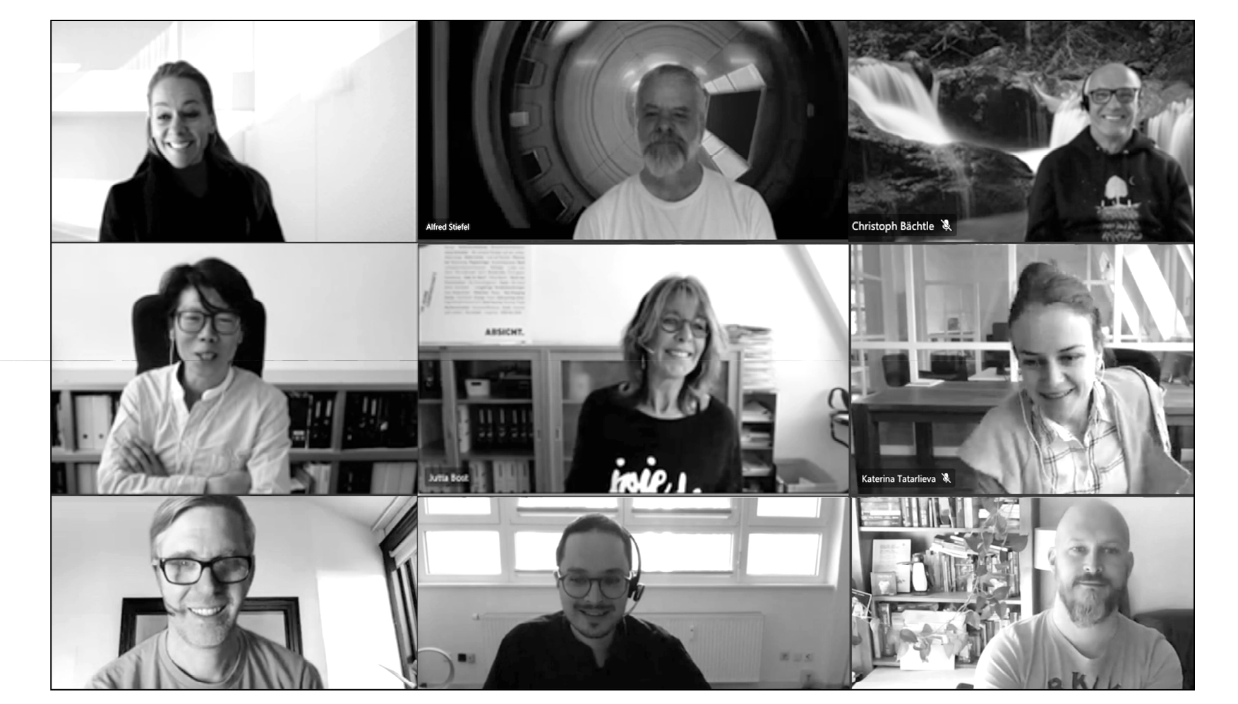 Nine people participating in a virtual meeting on video call, each in their own environment, smiling and engaging.