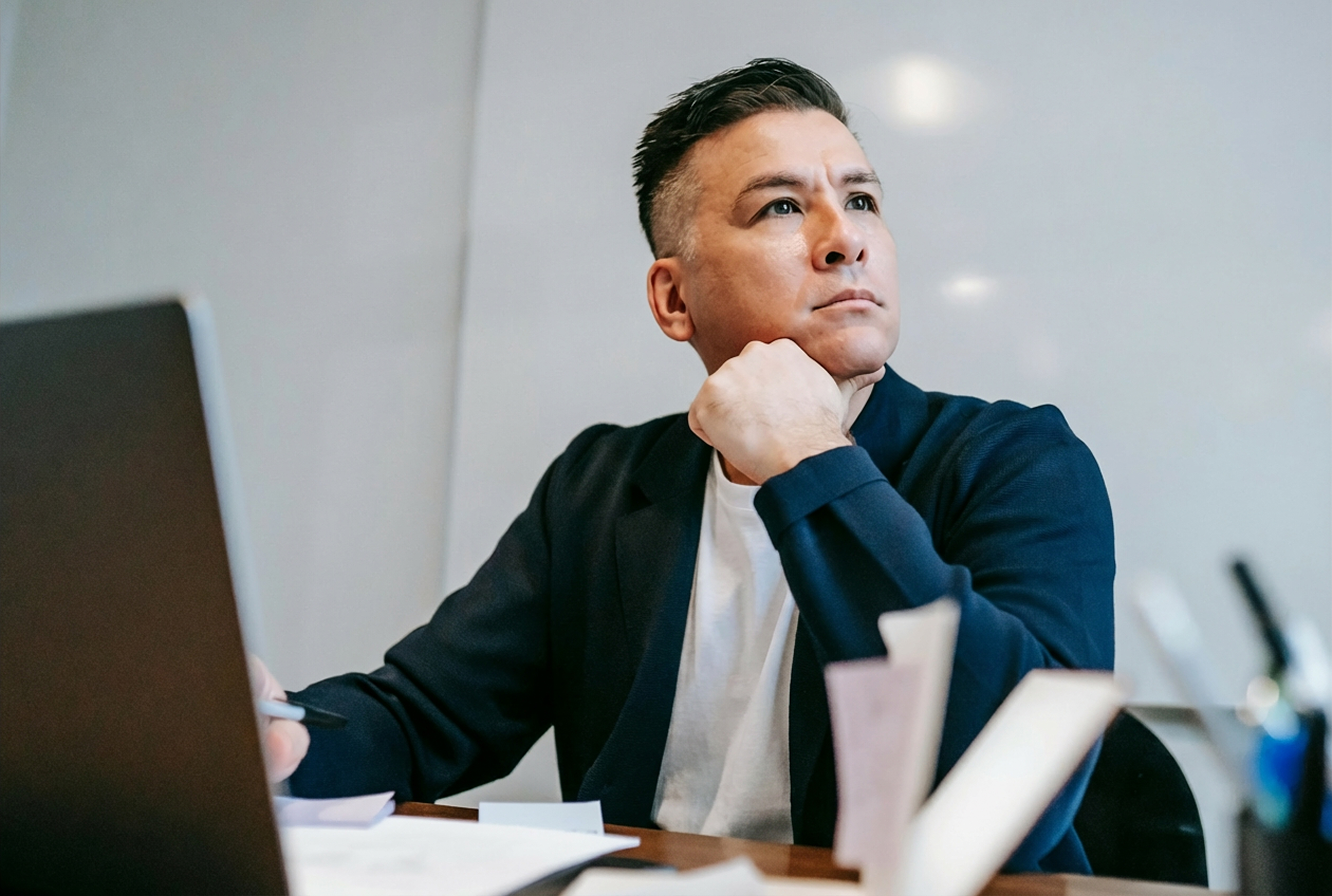 business man thinking about finance with help of Qonfin