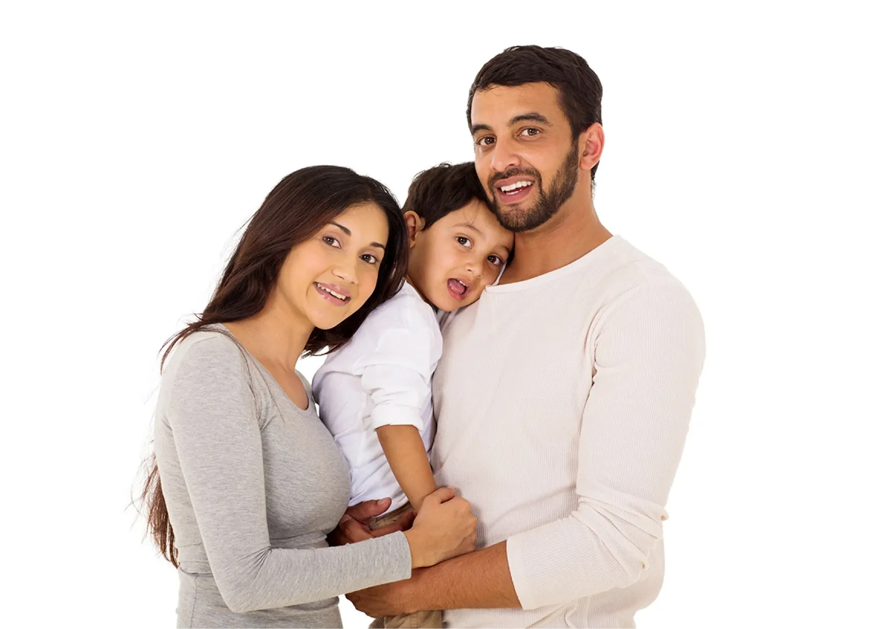Smiling family with a mother, father, and young son embraced together against a white background.