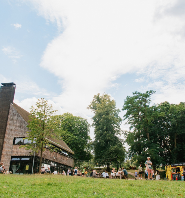 Image of a crowd enjoying street food outsdie the cafe at Crystal Palace Park