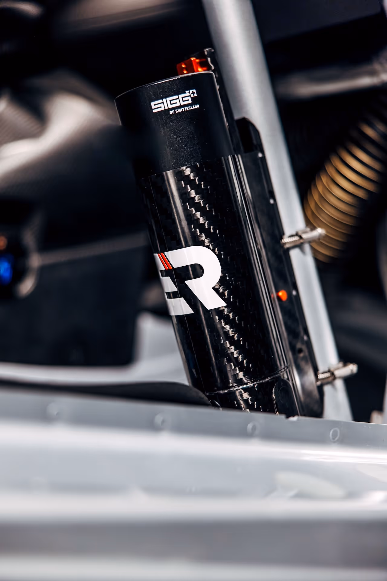 Close-up of the lightweight drinking-system with SIGG bottle inside a racecars chassis.