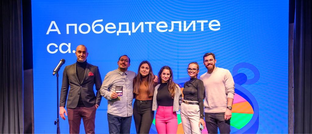 Black and white photograph of a group of people on a stage.