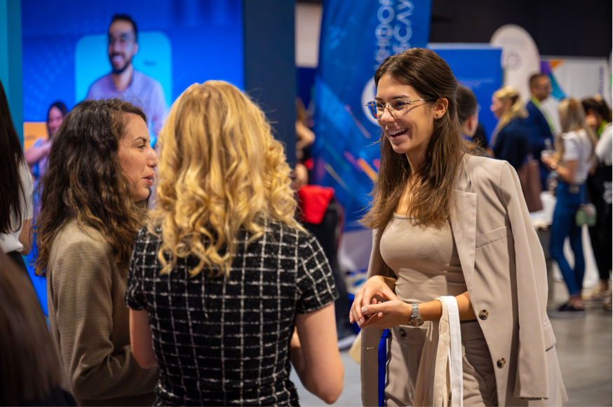 Portrait photograph of a woman with long hair, smiling.