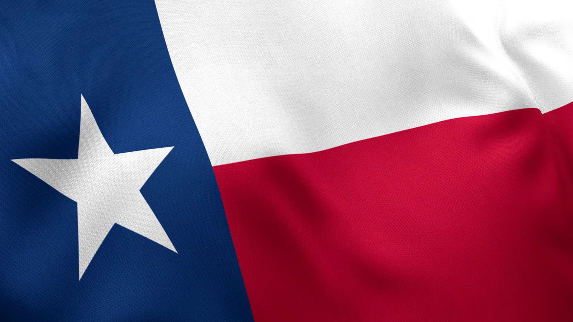 Texas state flag with a vertical blue stripe and white star on the left, horizontal white stripe on top, and red stripe on the bottom.