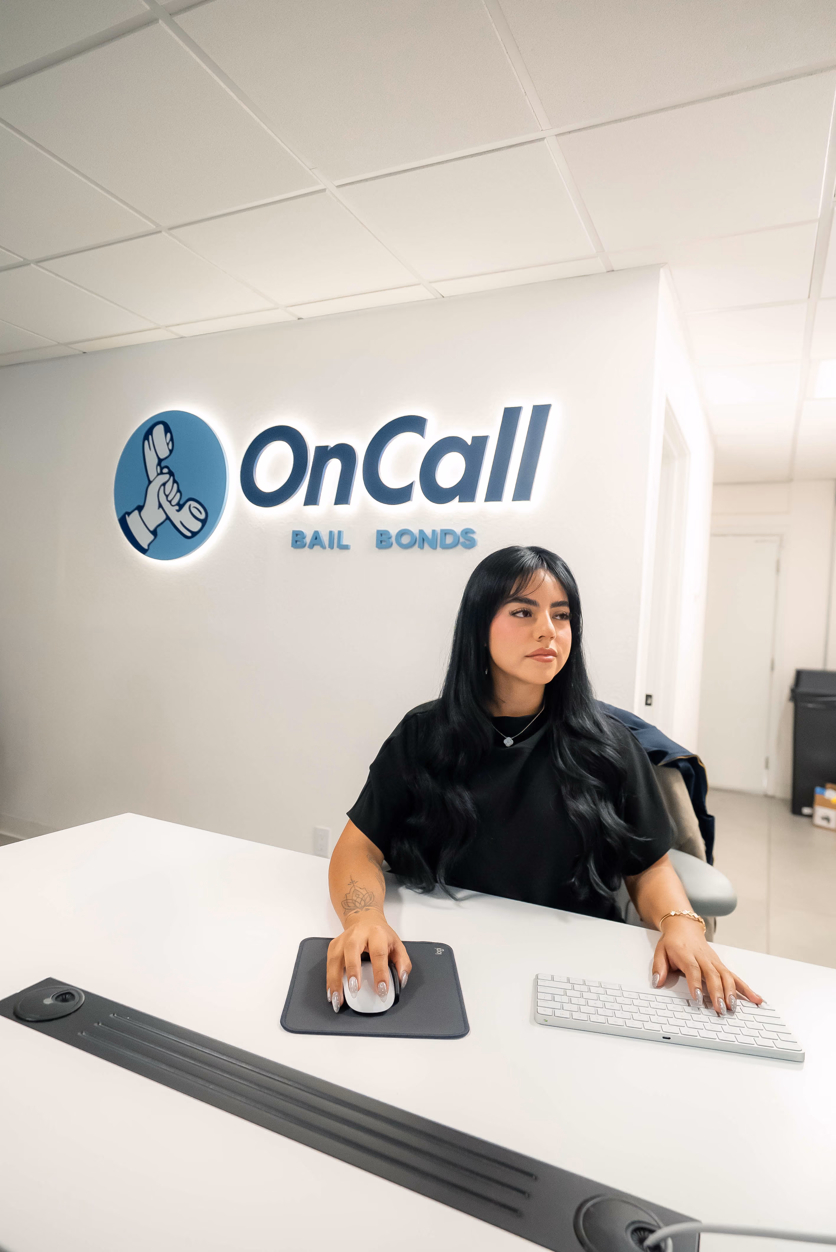 OnCall Bail Bonds agent at the front desk