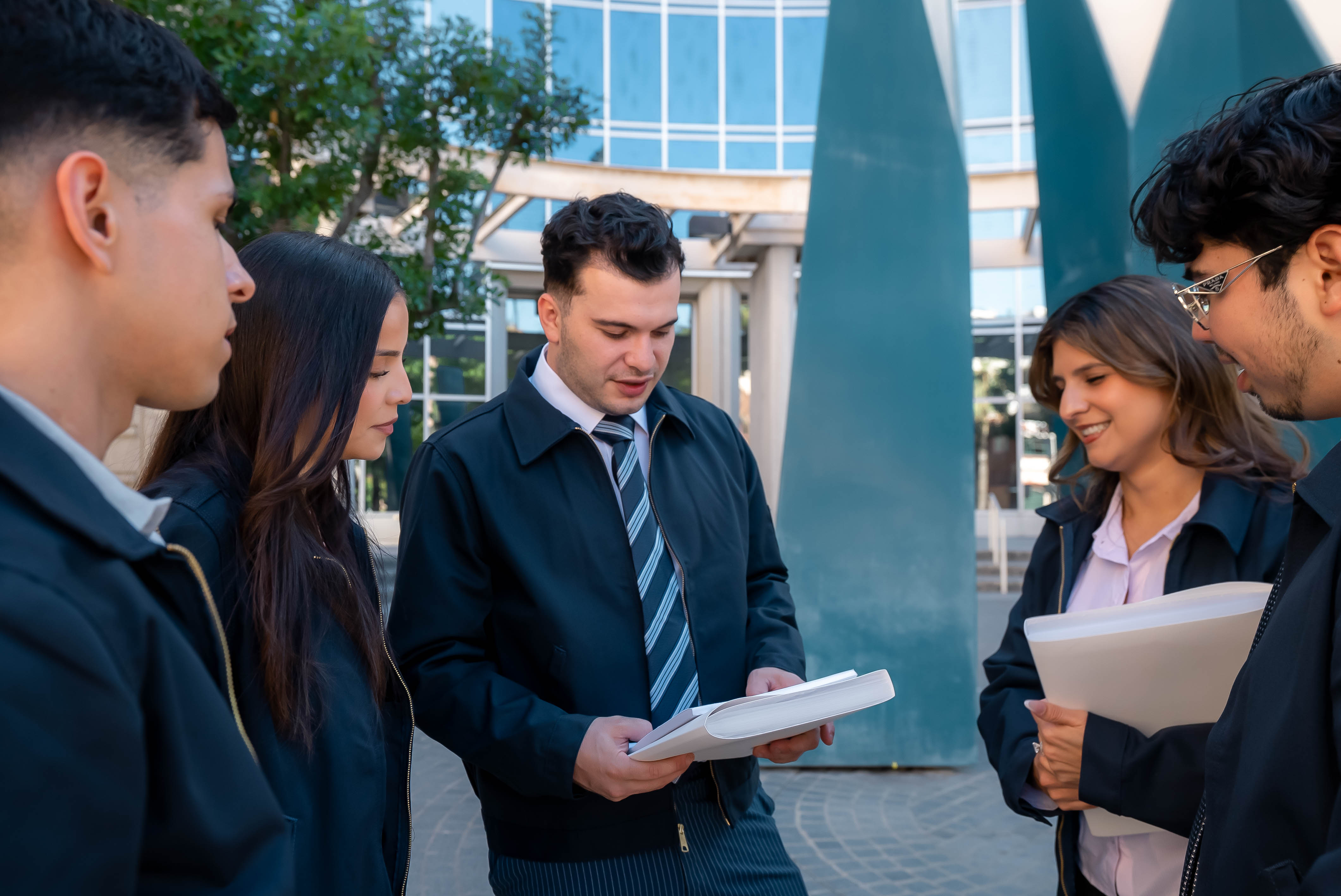 OnCall Bail Bonds team reviewing paperwork together outside the courthouse