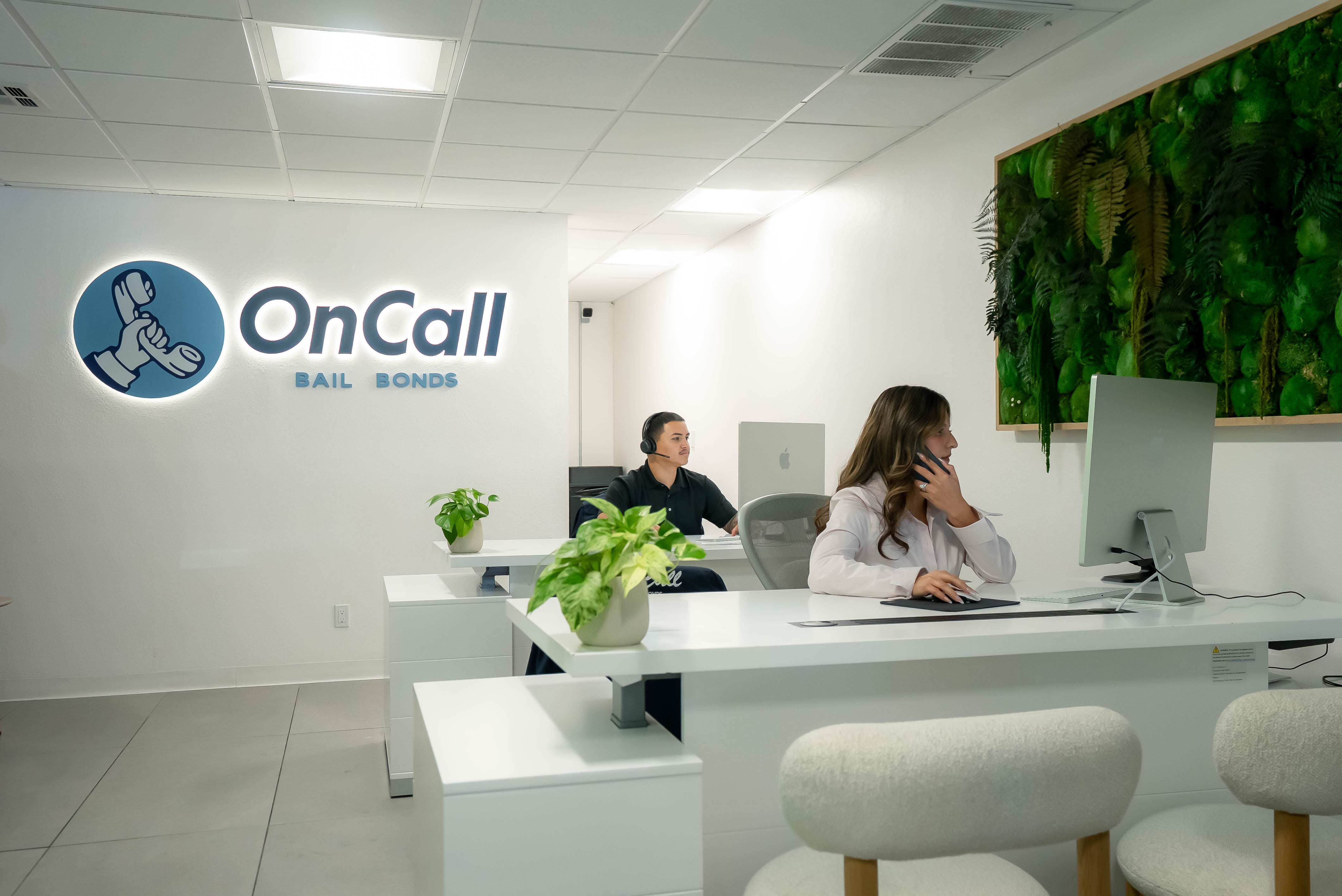 OnCall Bail Bonds agents taking calls at the front desk