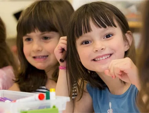 Two girls smiling