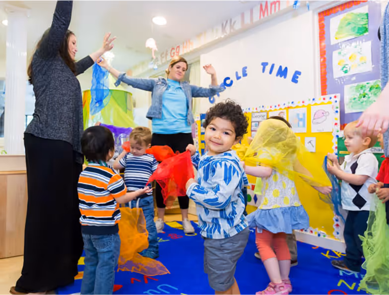 Children playing in a colorful carpet