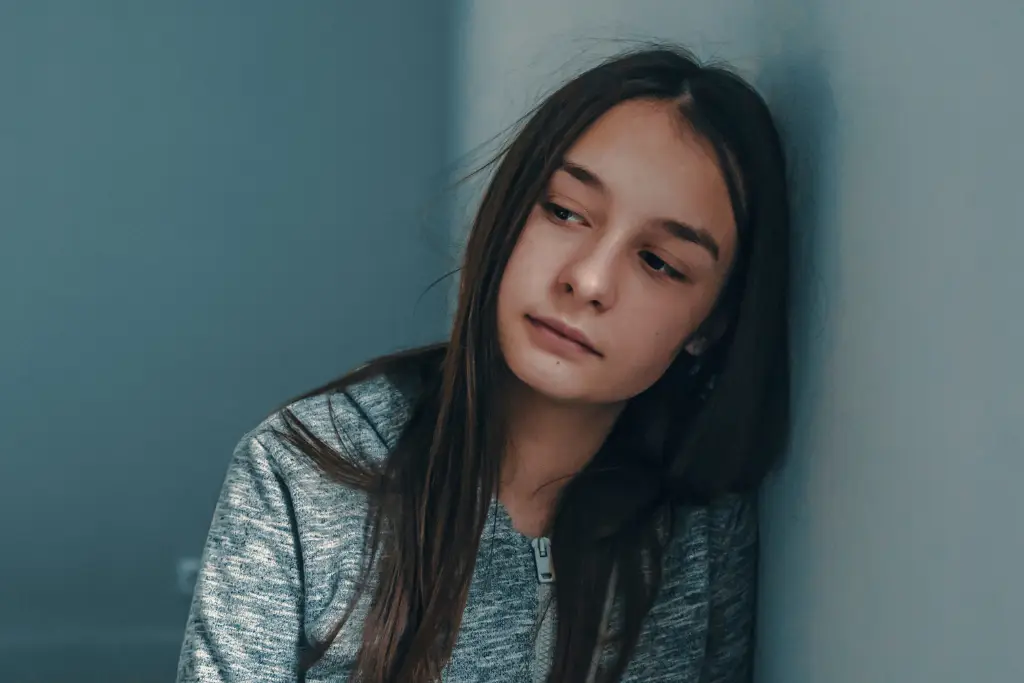 Graphic titled 'Anxiety Coping Skills for Teens,' featuring a diverse group of teenagers practicing coping techniques like deep breathing, journaling, exercising, and talking to a trusted adult, with calming colors and supportive text labels.