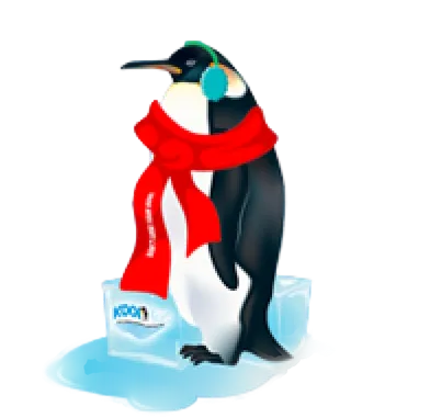Emperor penguin wearing green earmuffs and a red scarf, standing on a melting ice block.