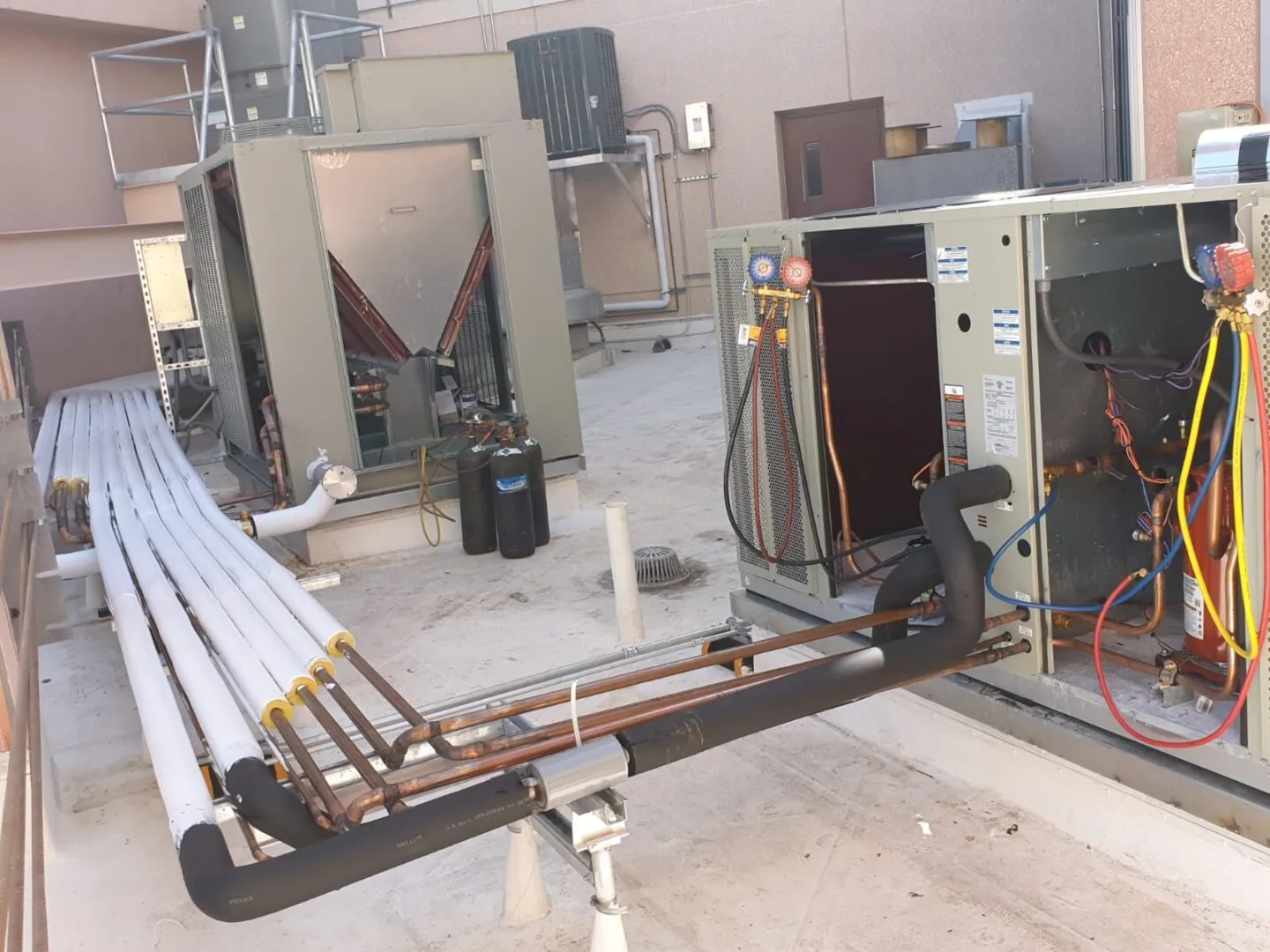 Industrial HVAC system with copper pipes and electrical connections