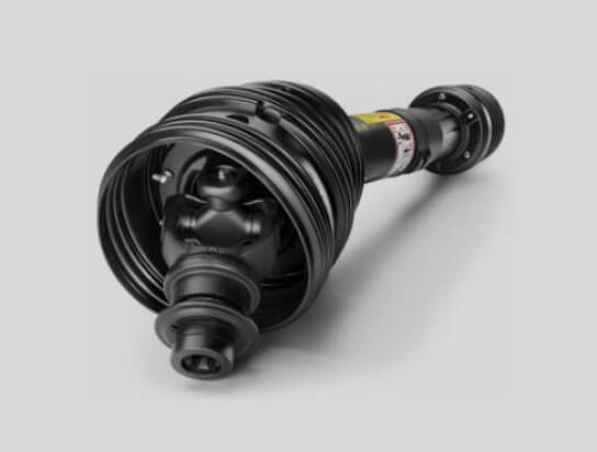 Black mechanical driveshaft with protective casing on a light grey background.