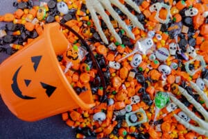 Pile of halloween candy spilling out of bucket