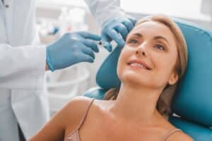 Woman smiling from receiving BOTOX and dermal fillers now offered at Priest Dental in Ashland, OH