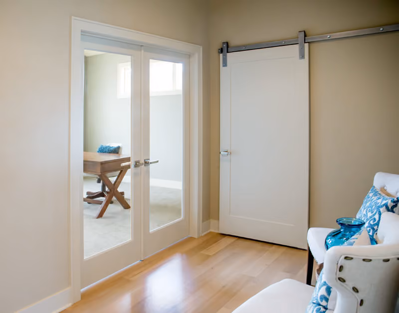 FPR01 Primed Stile and Rail French Door with SMSA1 Primed Molded, Silver Barn Door Track and Hardware, 176A Primed Casing, 239A Primed Base and 200 Primed Base Beauty Shot