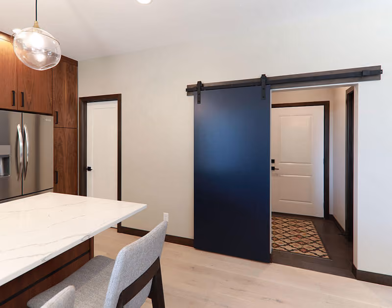Flush Hardboard Door with Black Barn Door Hardware and Track Beauty Shot