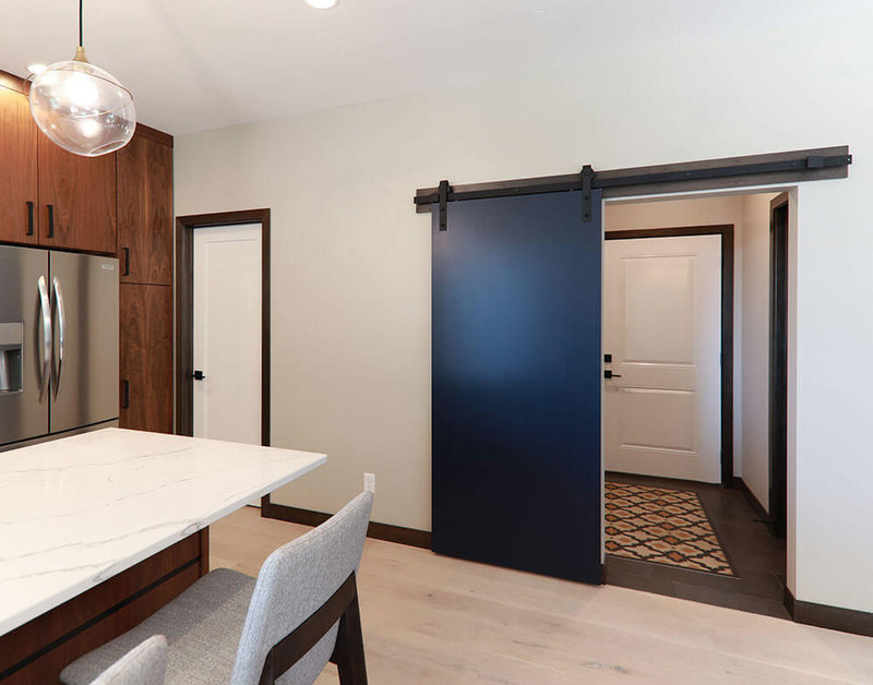 Flush Hardboard Door with Black Barn Door Hardware and Track Beauty Shot
