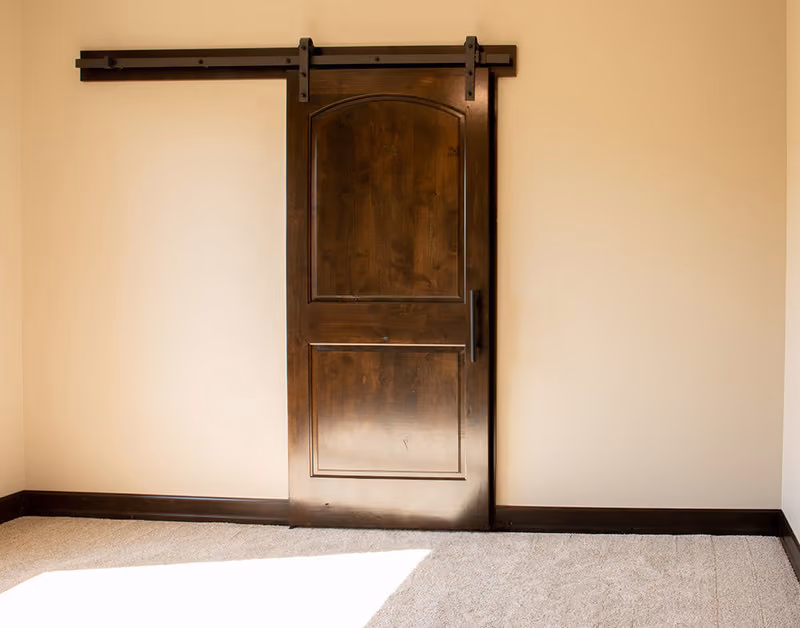 PAKB2 Knotty Alder Interior Door with Special Order Barn Door Track and Hardware Beauty Shot