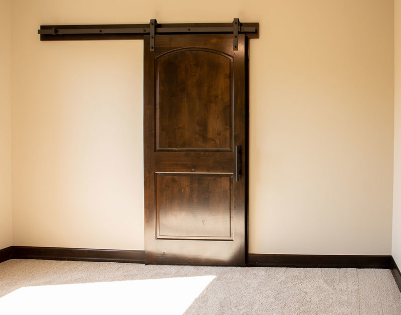 PAKB2 Knotty Alder Interior Door with Special Order Barn Door Track and Hardware Beauty Shot