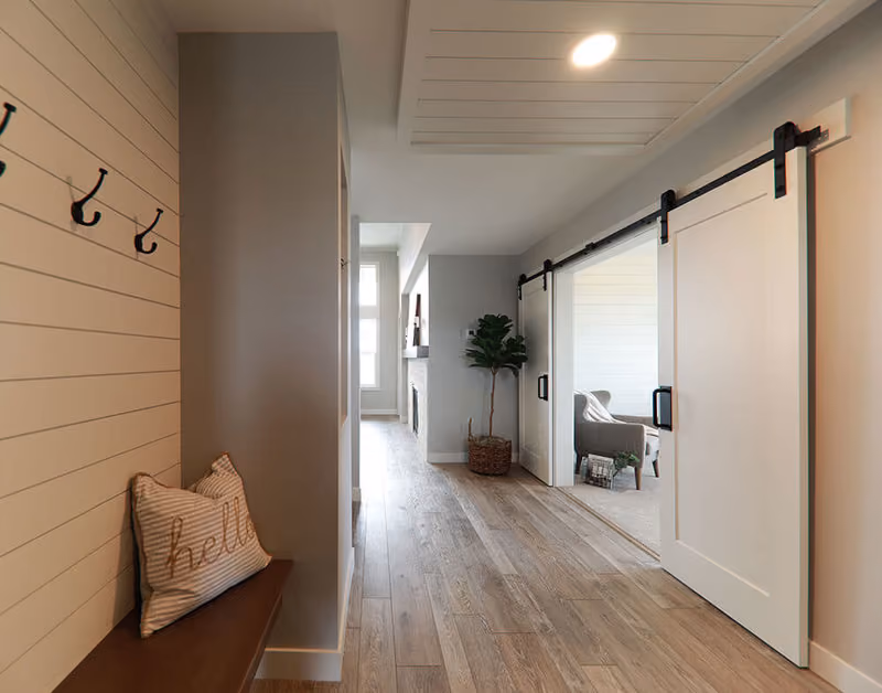 SMSA1 Primed Molded Door with Black Barn Door Hardware & Track Beauty Shot