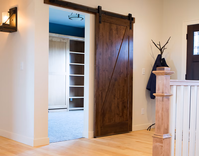 PAKCZ Knotty Alder Barn Door with Black Barn Door Track and Hardware Beauty Shot