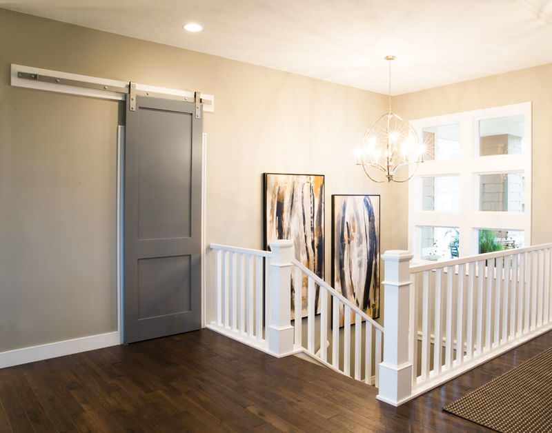S.O. 8ft Door with 176A Primed Casing, 239A Primed Base, Silver Barn Door Track and Hardware, 4091 Primed Box Newel, 5360 Primed Baluster and 6770 Rail  Beauty Shot