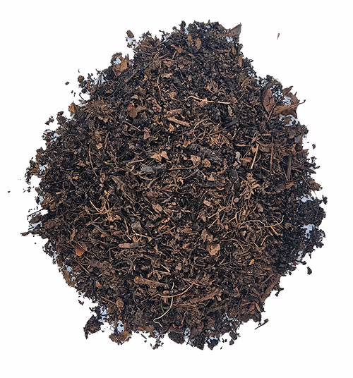 Pile of dark brown leaf mulch with small wood and organic debris on a white background.