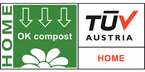 Green OK compost HOME certification label with three downward arrows and a plant icon, alongside the TÜV Austria logo.