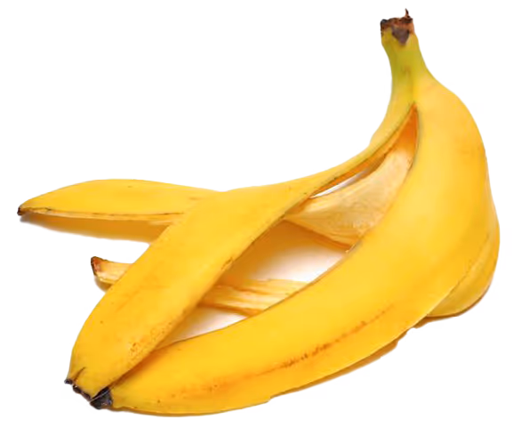 Bright yellow banana peel partially opened on a white background.