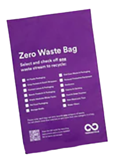 Purple zero waste bag listing recyclable materials such as snack packaging, plastic bags, and six-pack rings.