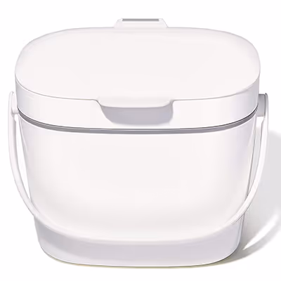 White compact, rectangular compost bin with a handle and hinged lid.