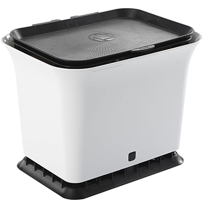 Compact white appliance with black top and base, likely a kitchen gadget or small household device.