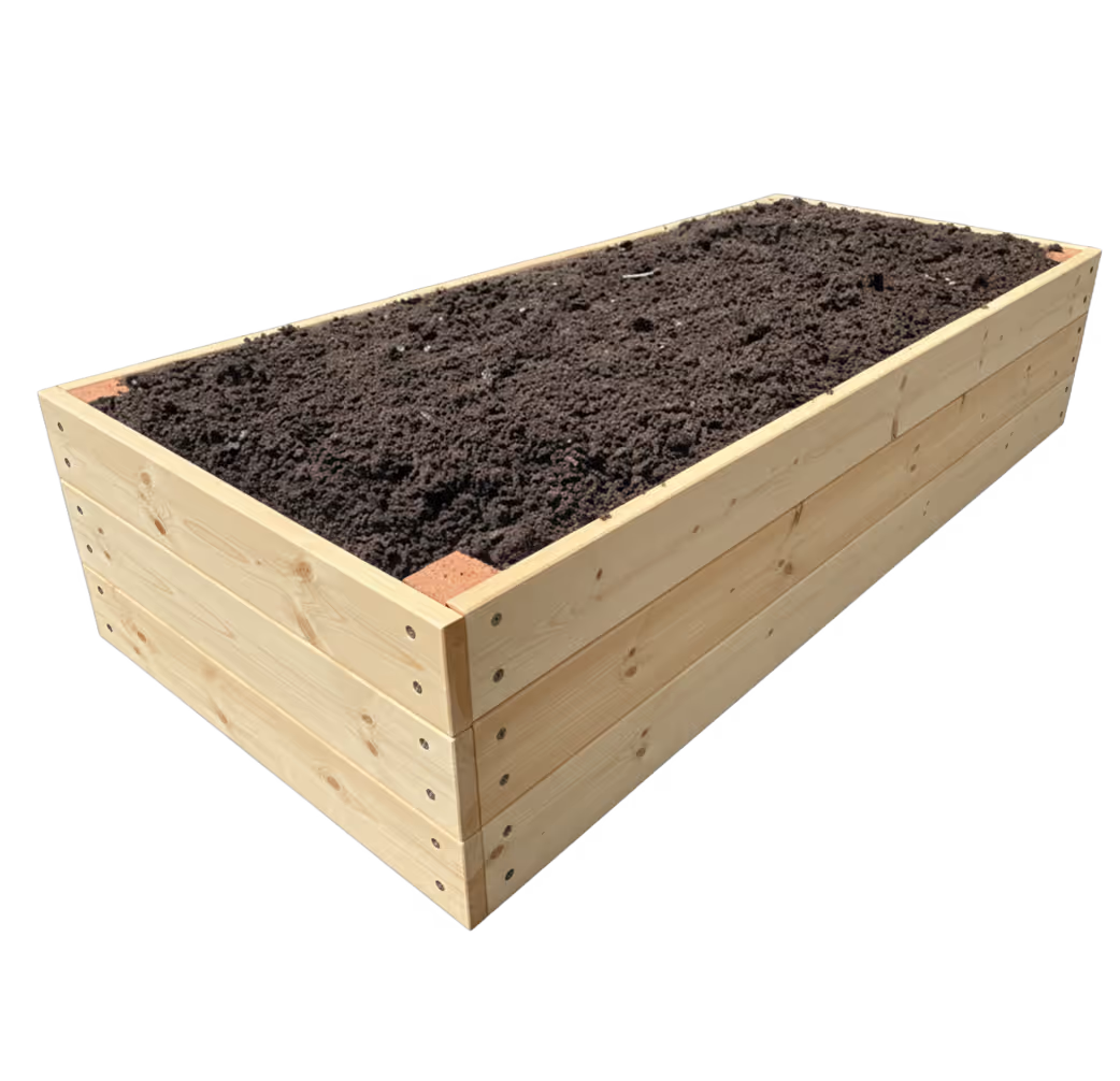 Rectangular wooden raised garden bed filled with dark soil.