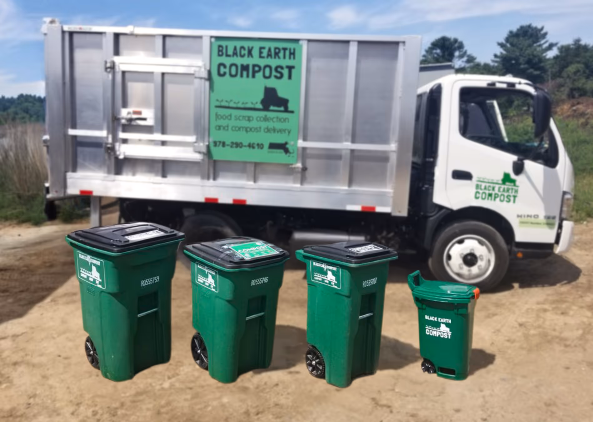 Four green compost bins of varying sizes in front of a Black Earth Compost food scrap collection and compost delivery truck.