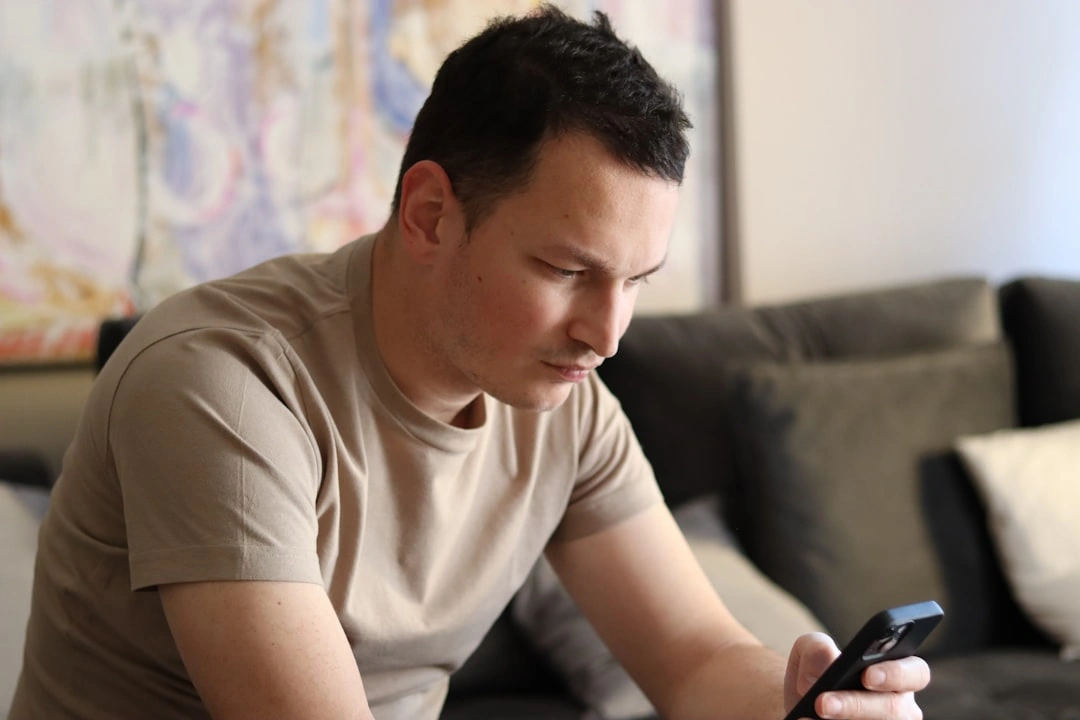 frustrated homeowner holding a phone while looking at an unanswered call screen