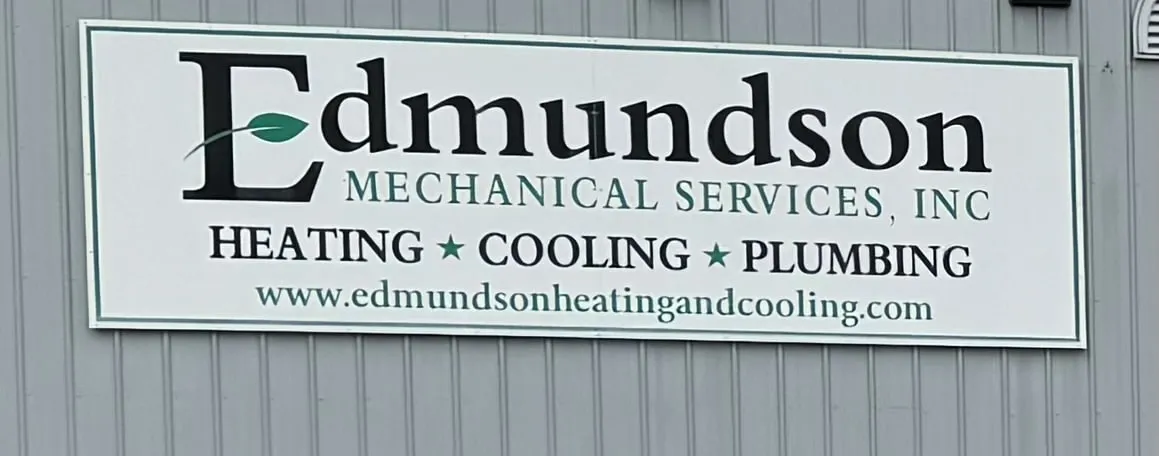 Sign for Edmundson Mechanical Services, Inc offering heating, cooling, and plumbing with website www.edmundsonheatingandcooling.com.