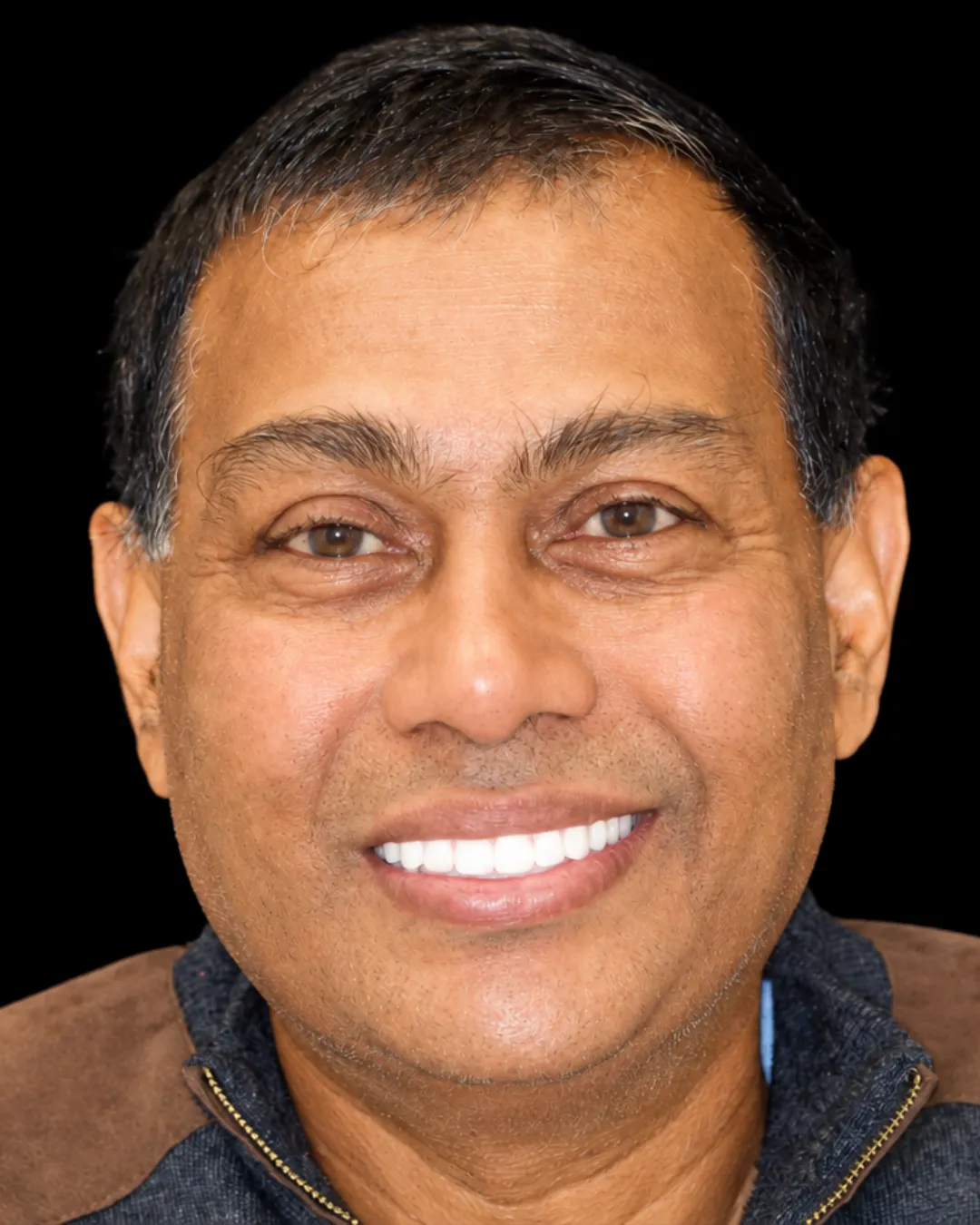 Tamesh smiling after treatment at Makris Dental Prosthodontics