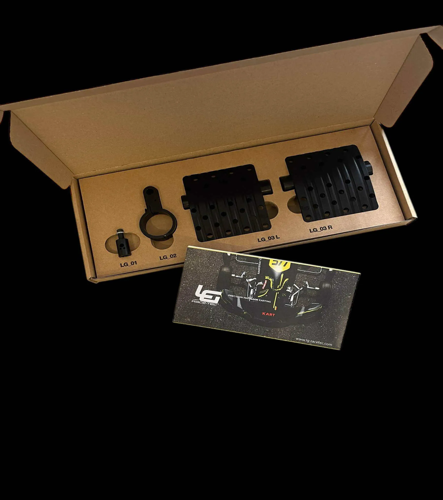 open box showing performance kart racing parts throttle, clamp and pedals inside