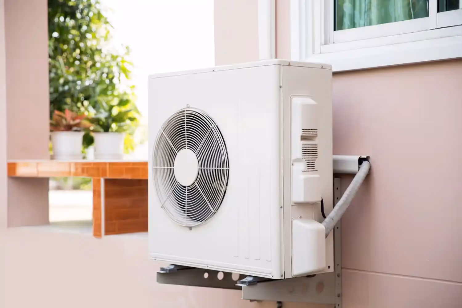 White mini-split outdoor heat pump.
