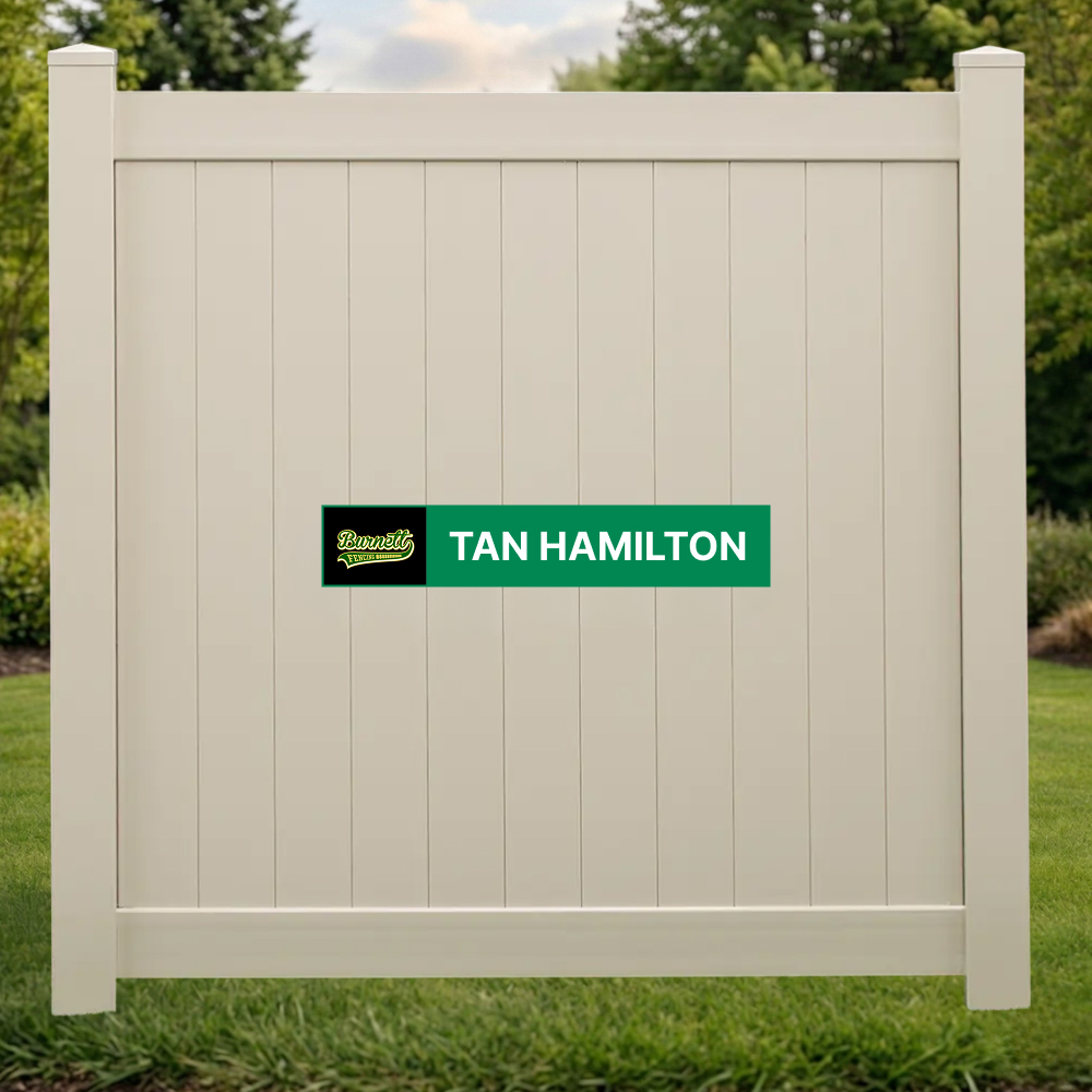 Tan Hamilton tan vinyl privacy fence panel on a backyard lawn