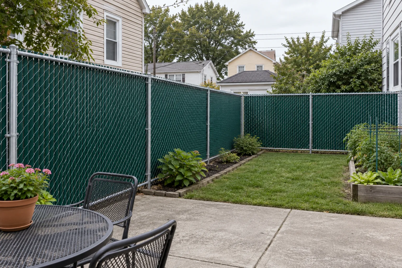 Chain link with privacy slats · full fence view