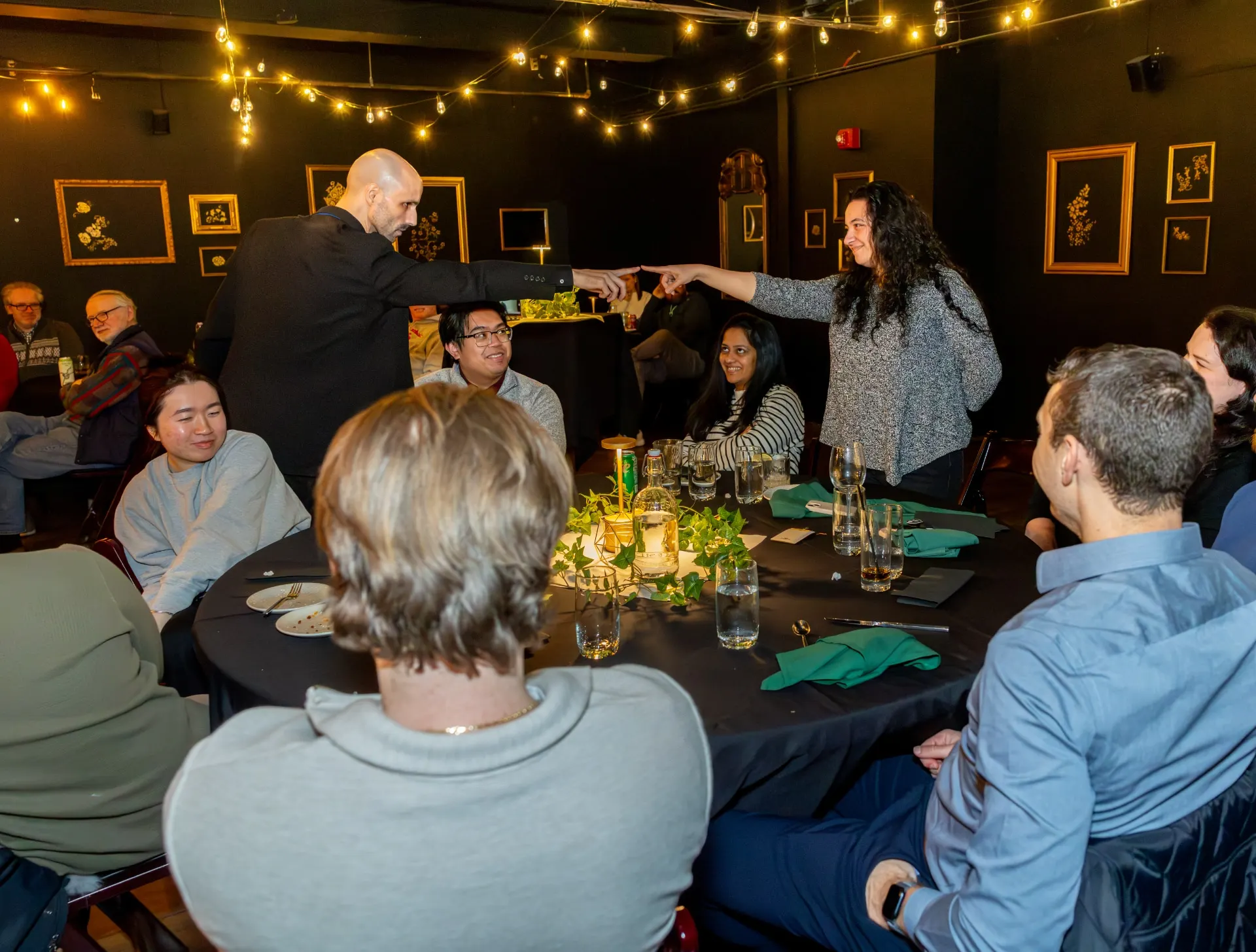 Jesse Dameron performing close-up magic for guests at Harper’s Garden inside Duane Morris Plaza in Philadelphia.