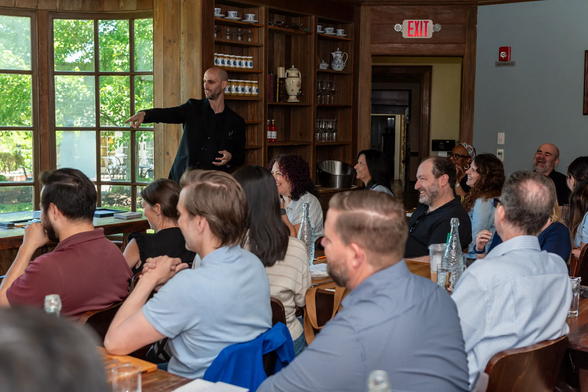 Jesse Dameron performing interactive comedy magic for Otsuka Pharmaceutical team members during a corporate retreat near Princeton.
