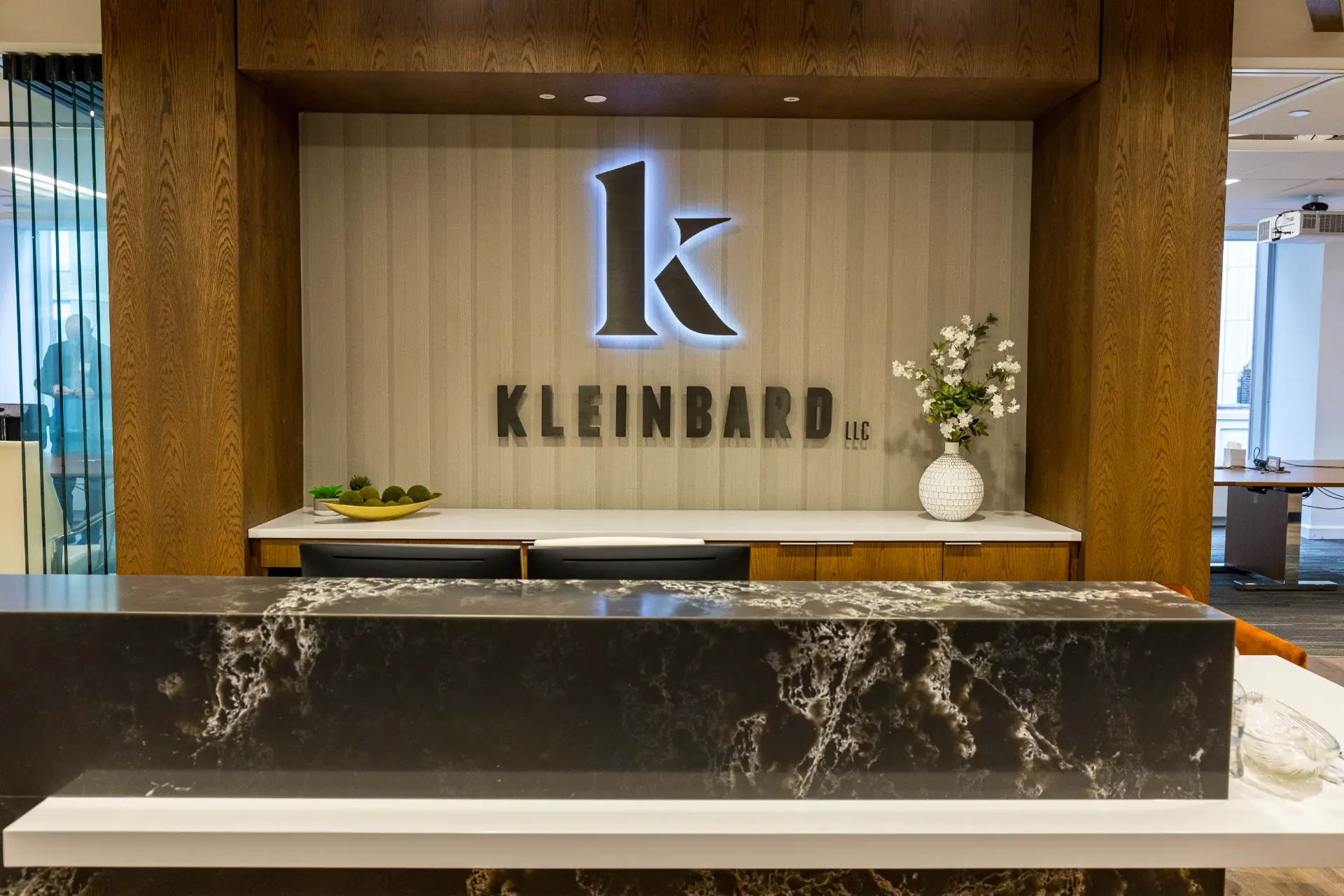 Kleinbard LLC reception area with backlit logo, at Three Logan Square in Philadelphia