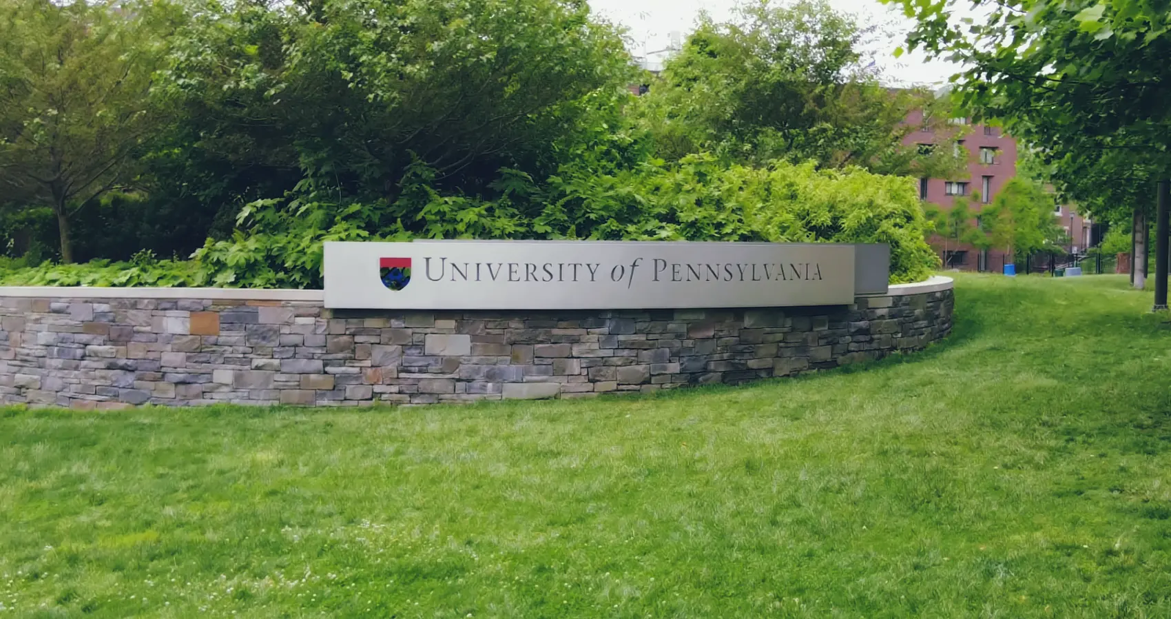 UPenn building and a sign that says "University of Pennsylvania"