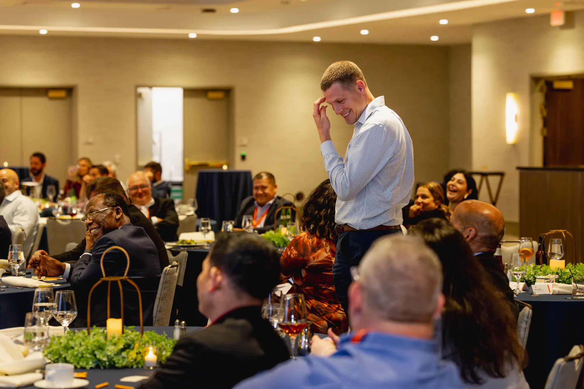 Villa Restaurant Group attendees laughing during Jesse Dameron’s show at Wind Creek Bethlehem